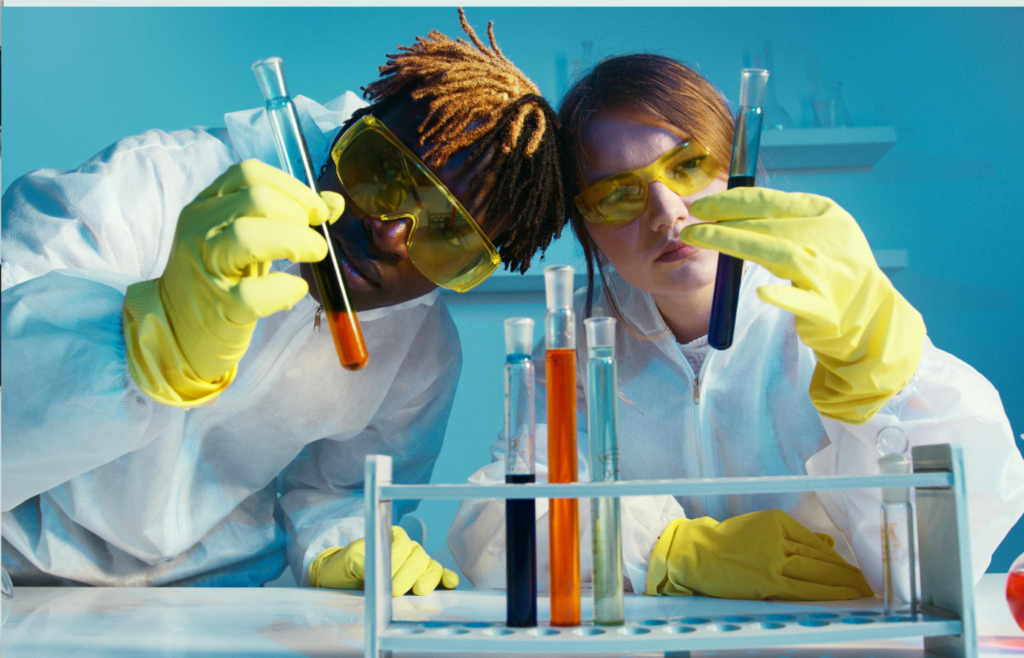 A scientist examining battery cells in a lab