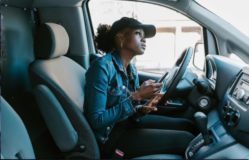 A driver using voice commands in a modern car