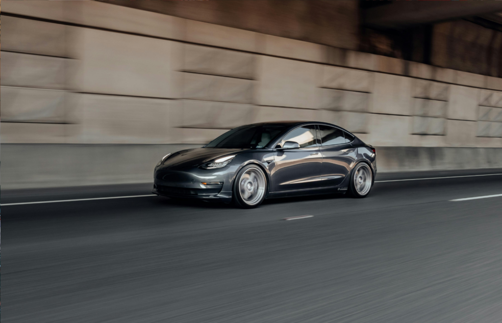 A futuristic self-driving car on an empty highway