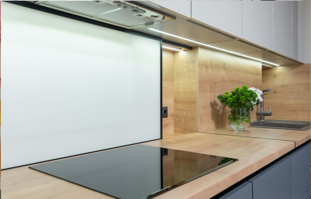 A sleek induction cooktop with a touch control panel.