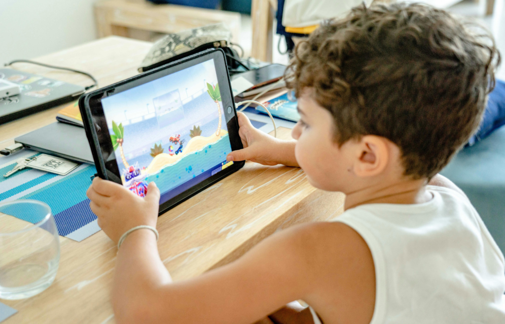 A built-in rear screen with a cartoon playing while a kid stares at an iPad instead