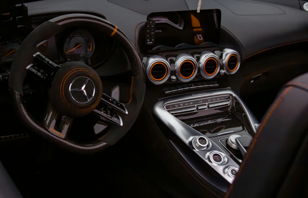 A carbon fiber trim in a luxury car interior