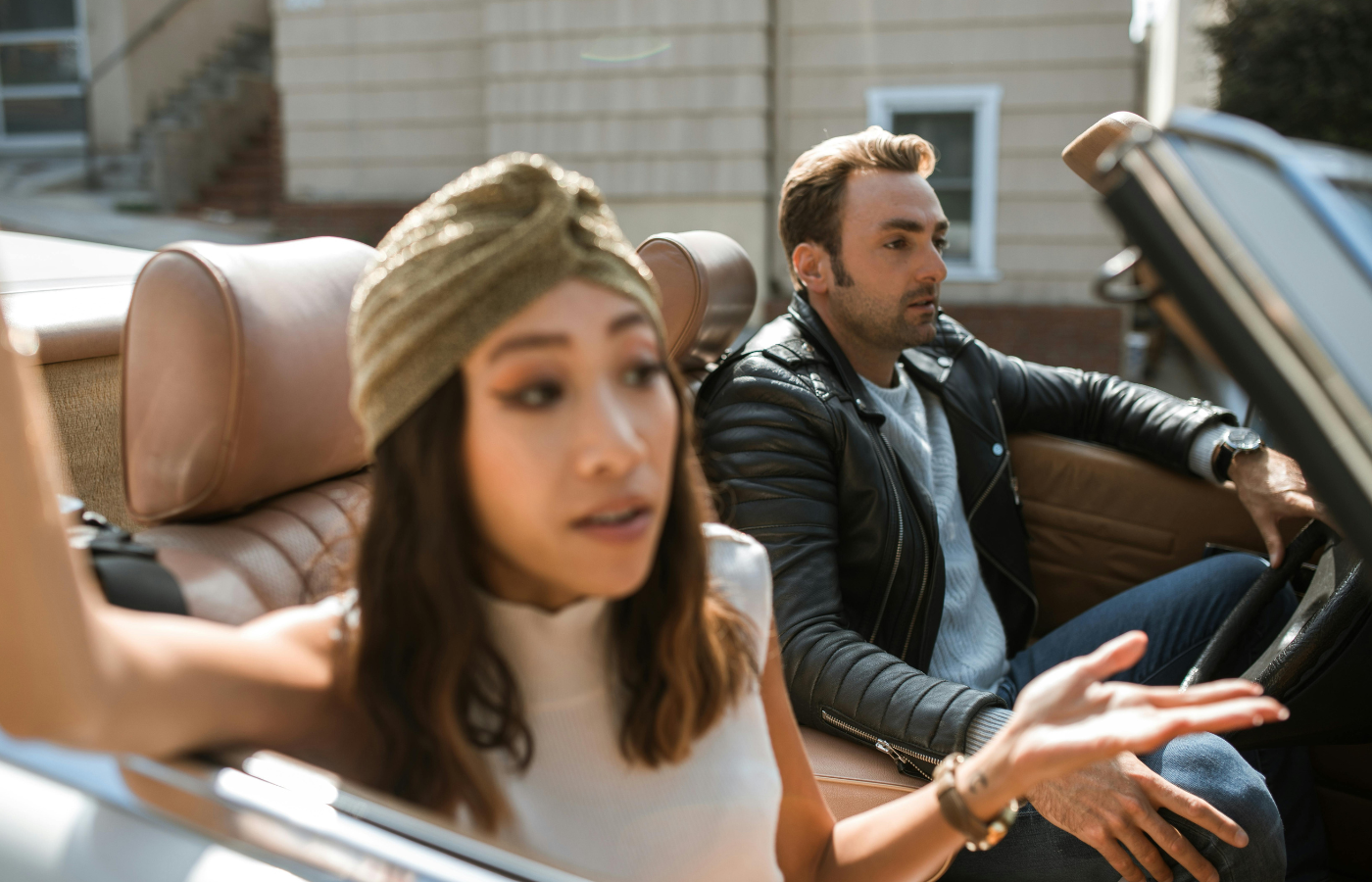 A convertible’s retractable hardtop mid-fold car