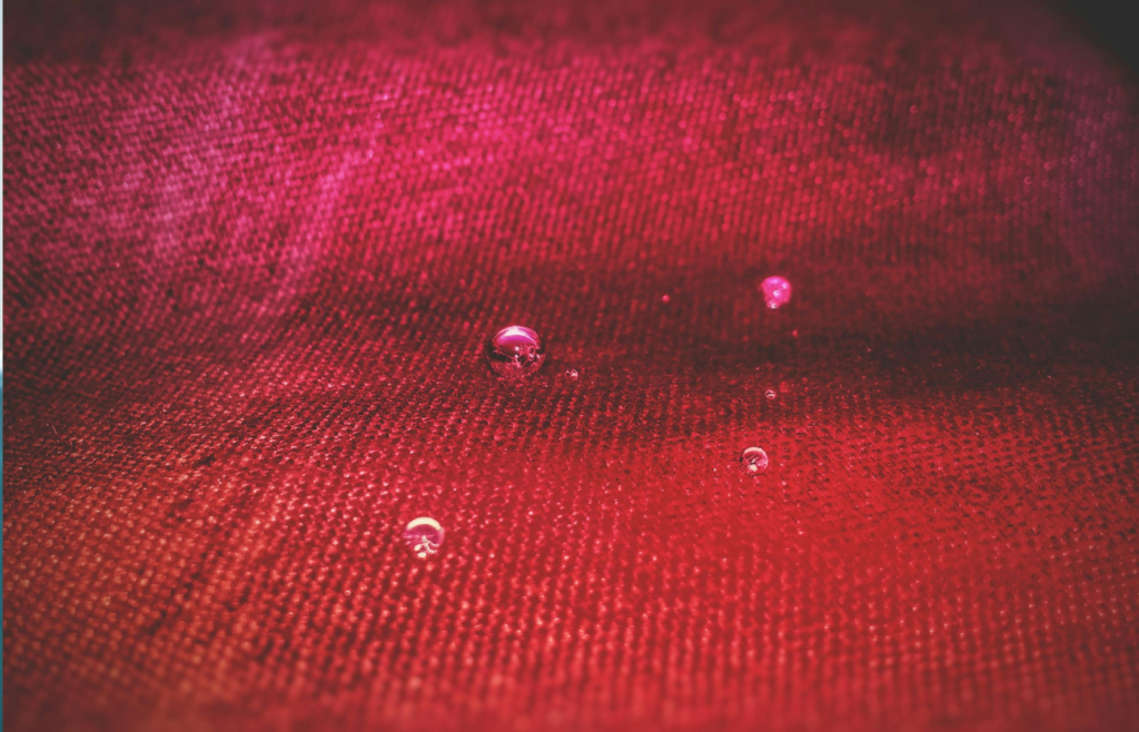 A close-up of futuristic fabric with water-repellent properties