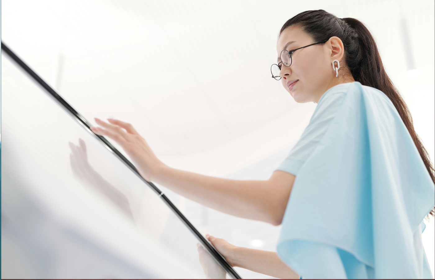 A woman wearing AR glasses