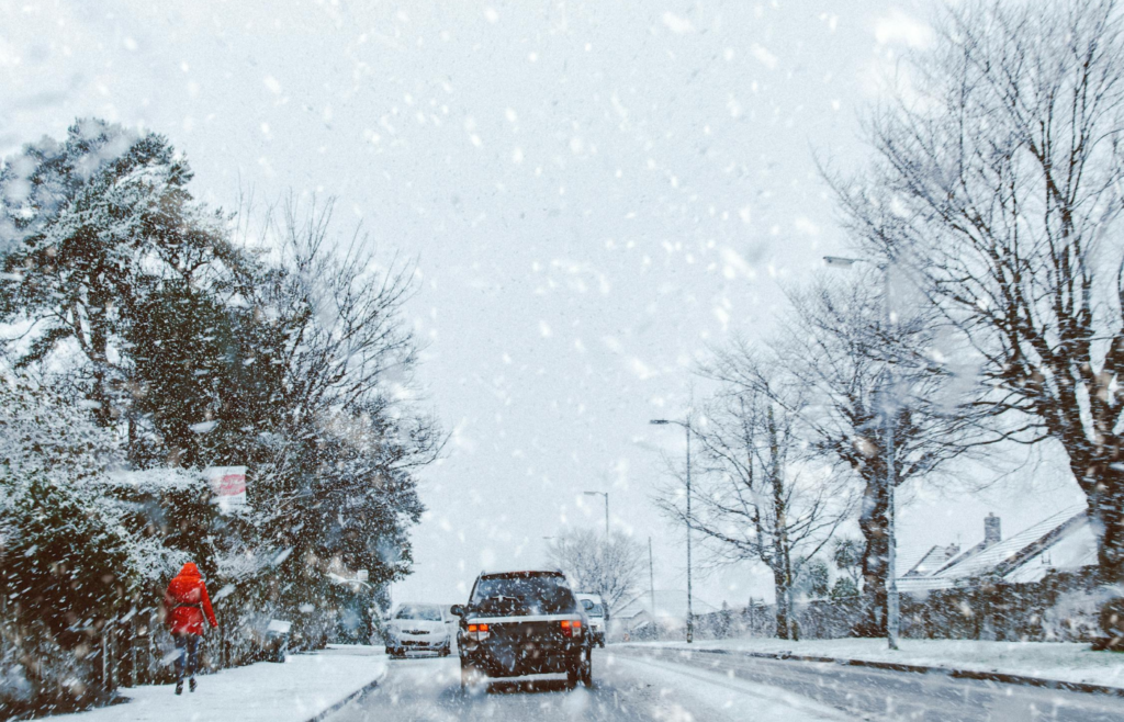 A car driving on a snowy road