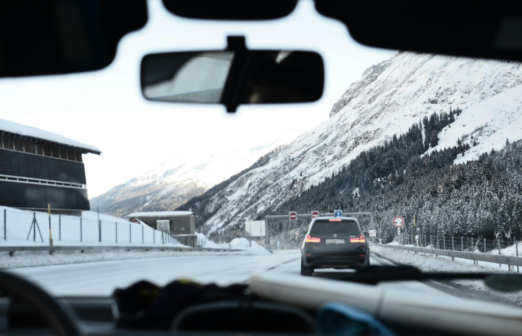 A scenic highway with a gas car and mountain views