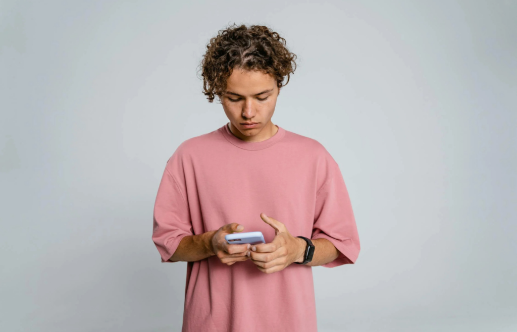 Teen scrolling through social media with a concerned expression