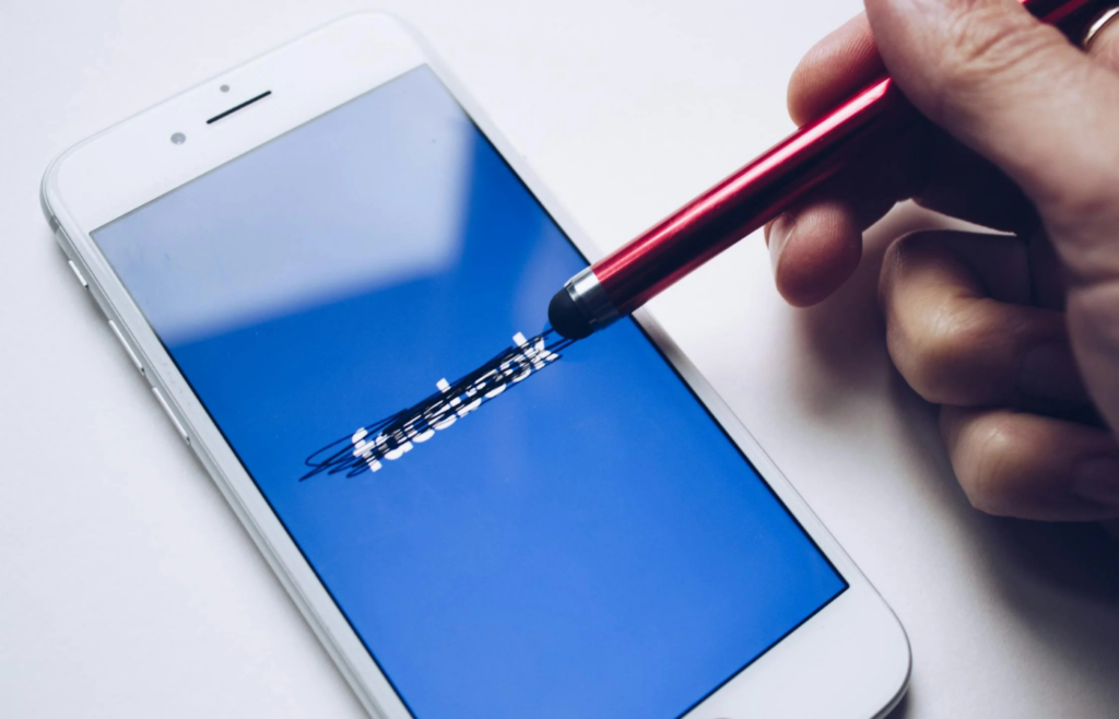 Individual turning off social media notifications on a smartphone