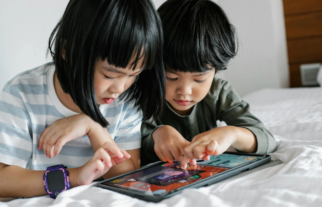 Child interacting with an educational app on a tablet
