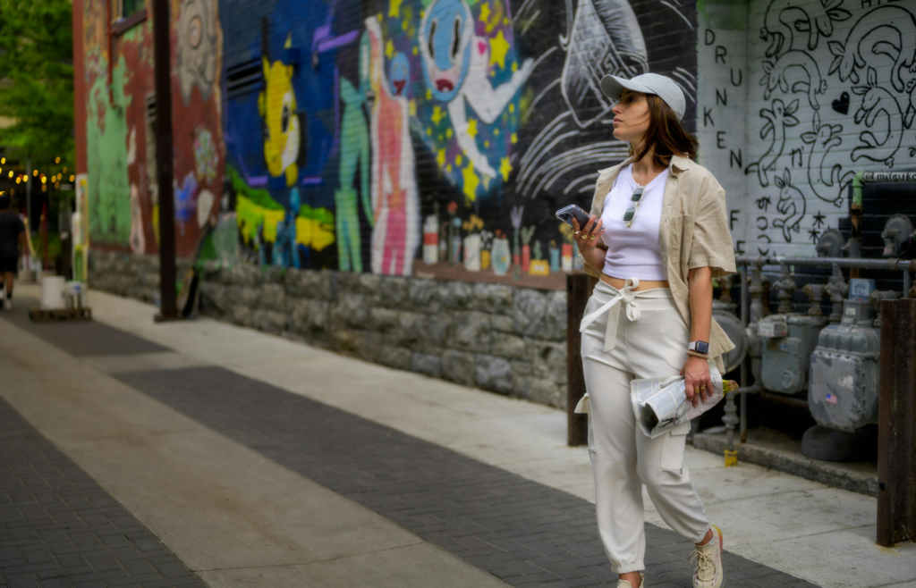 Stylish Woman Holding Cellphone