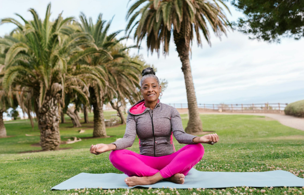 Person meditating in a park