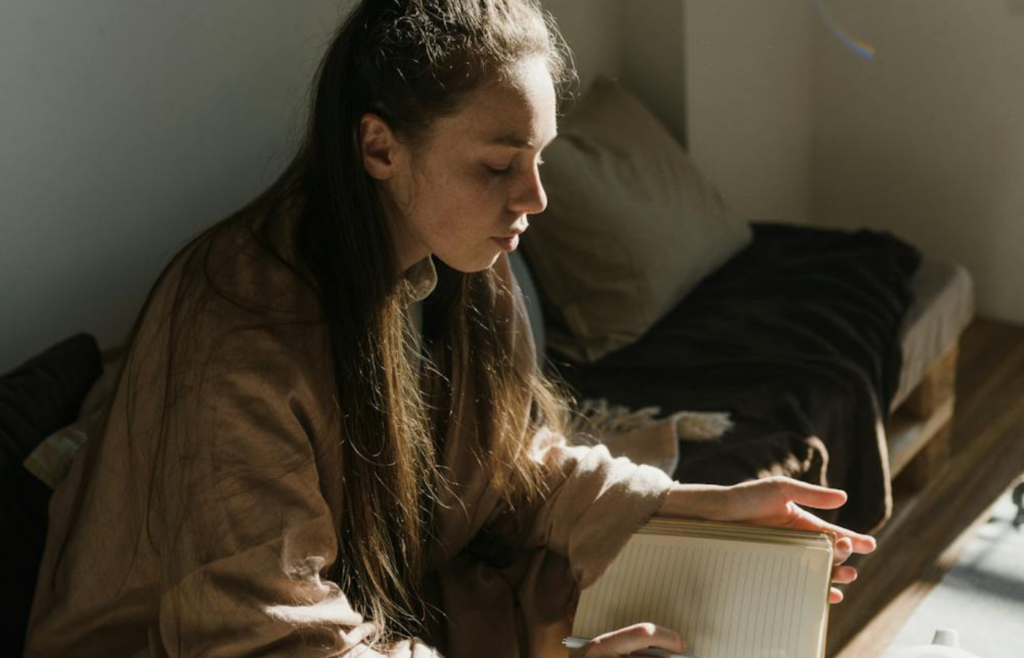 Person journaling in the morning light