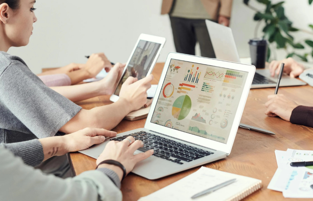 Analyst interpreting graphs and charts on a computer