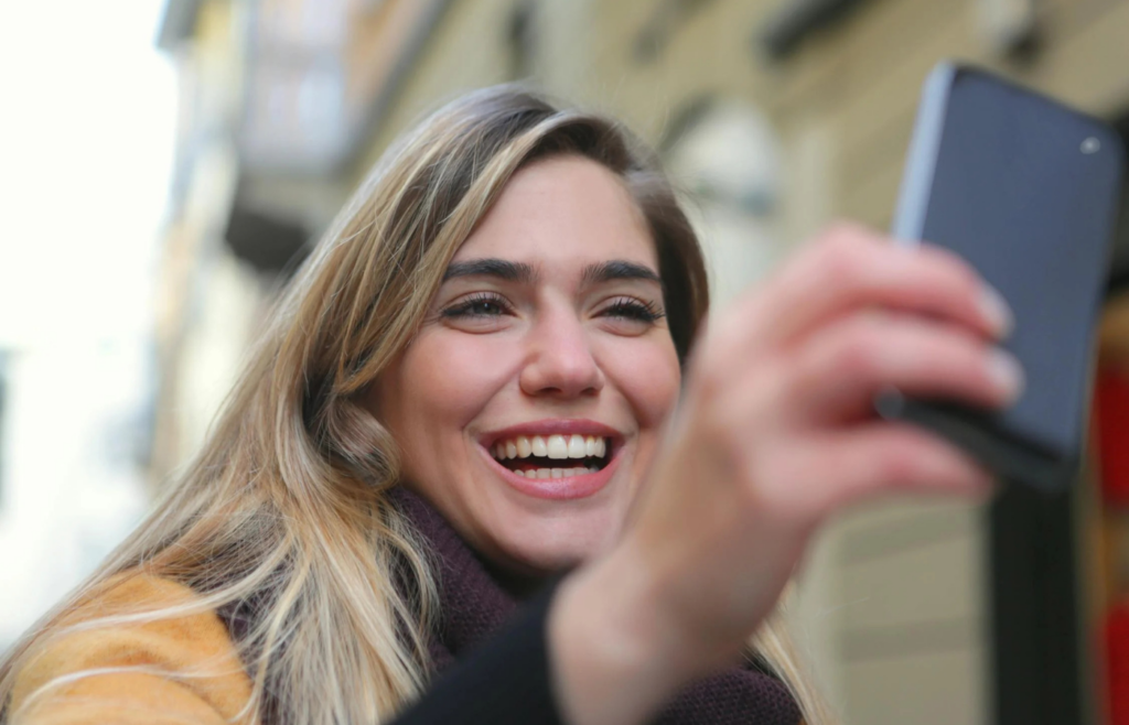 Person using facial recognition on a smartphone