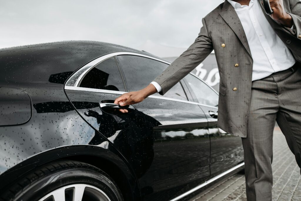 Man Opening a Car Door
