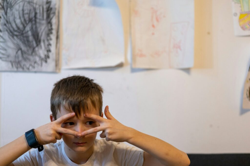 boy with hands on face
