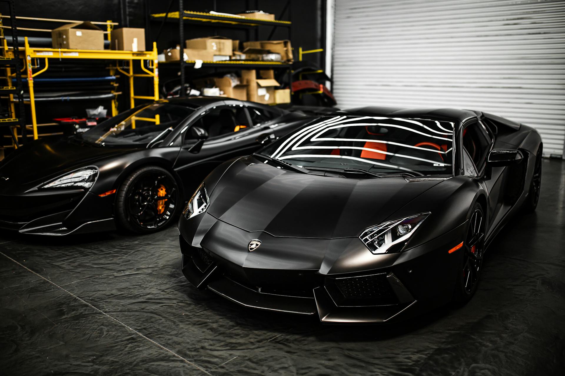 exotic black cars parked